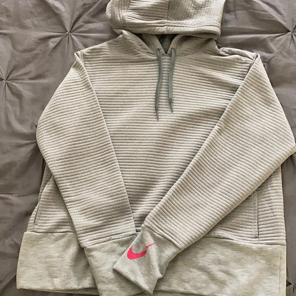 Women’s Nike Dri-Fit size large light grey hoodie sweatshirt with pockets.